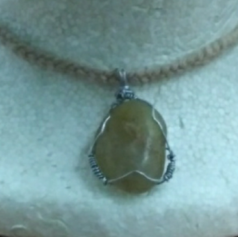 Handcrafted stone pendant in silverplated wire